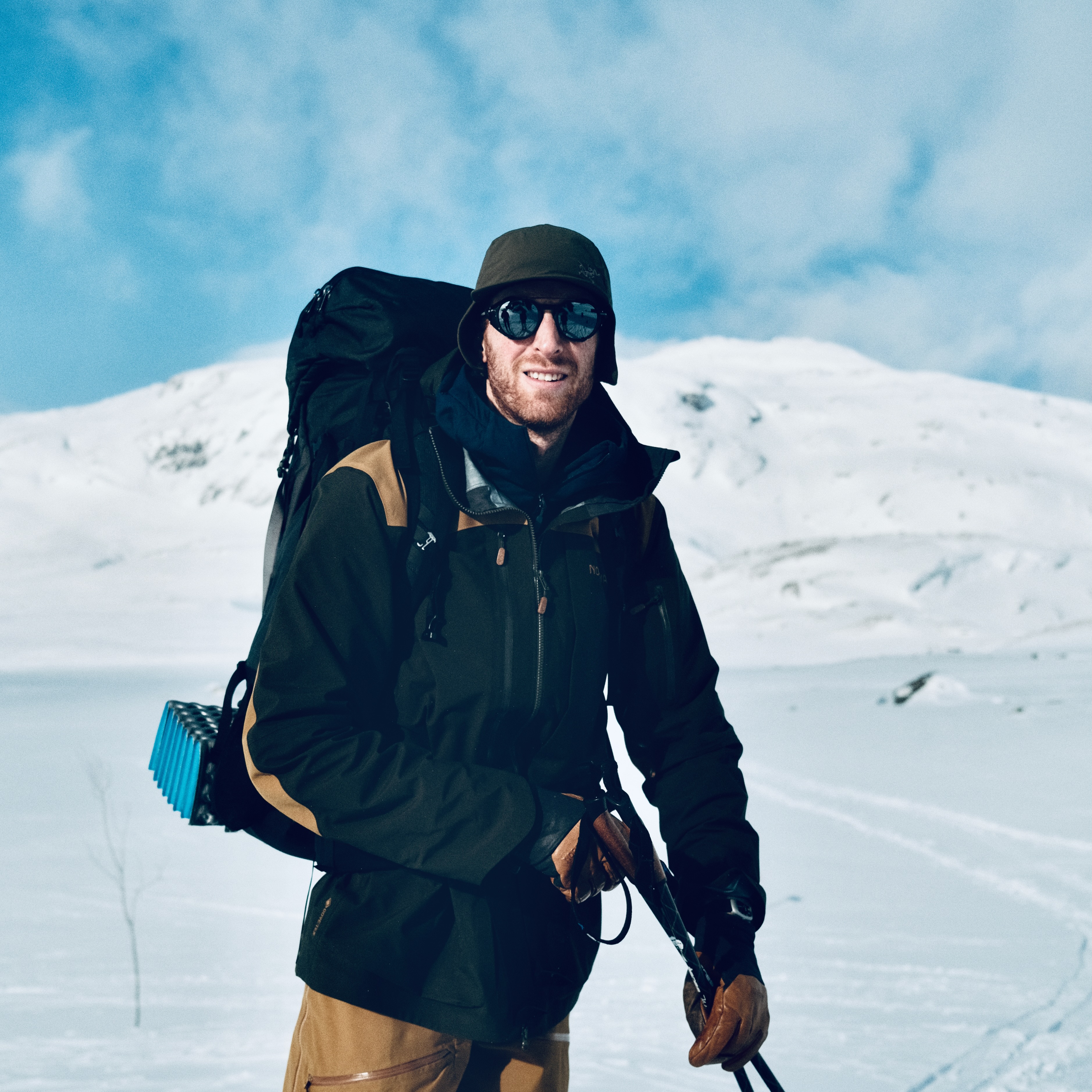 Ski tourer in the winter mountains wearing Montude